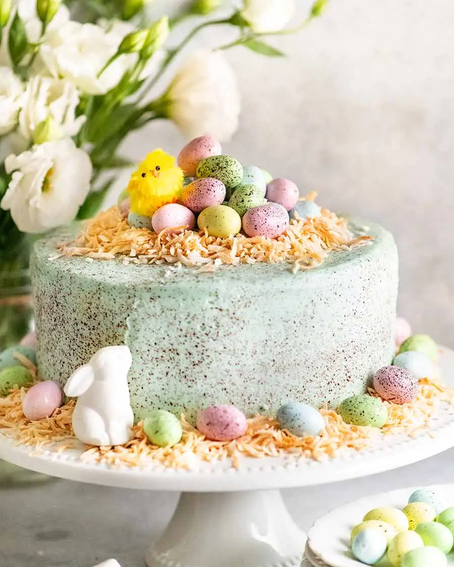 Easter cake with candy eggs and chocolate bunny.