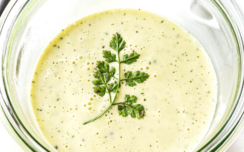 30 second Béarnaise sauce in a jar with sprig of chervil.