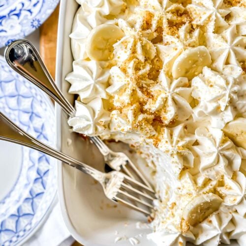 Banana pudding icebox cake in a white pan with forks.