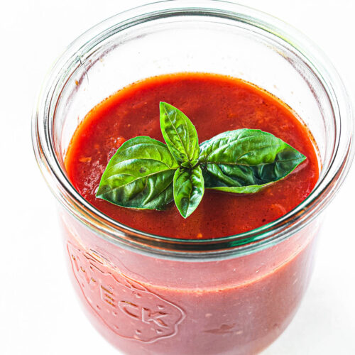 quick San Marzano Tomato Sauce in a jar with fresh basil.