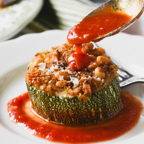 stuffed zucchini with tomato sauce.