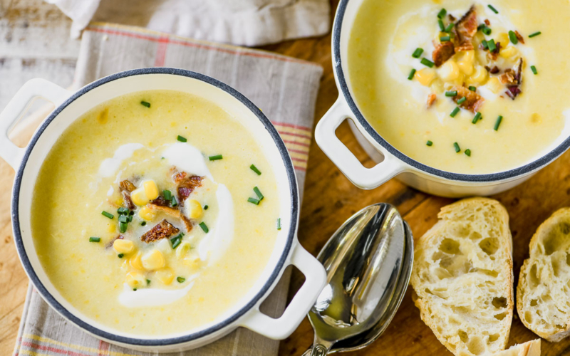 Sweet corn and bacon soup in small cast iron pots.