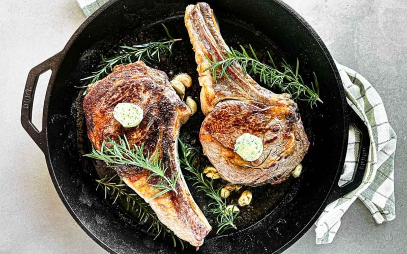 pan searing ribeye steak in a cast iron skillet.