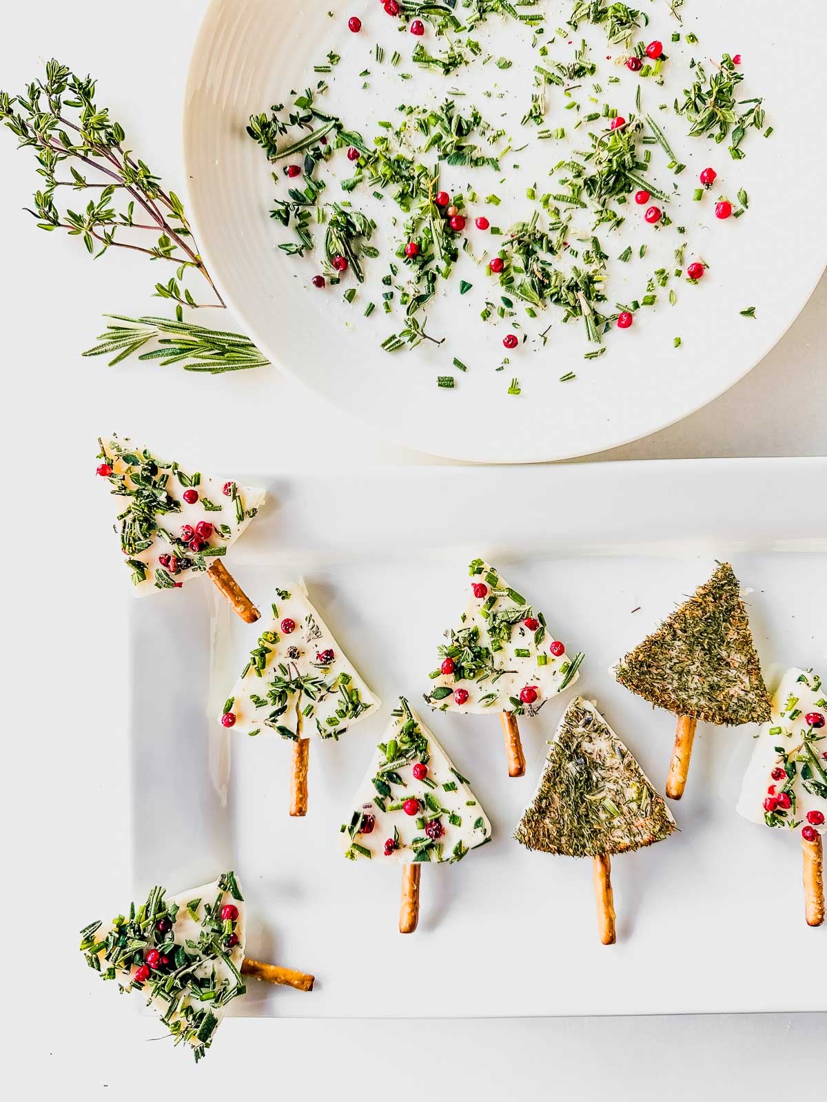 Making cute Christmas tree cheese wedges for a holiday appetizer.