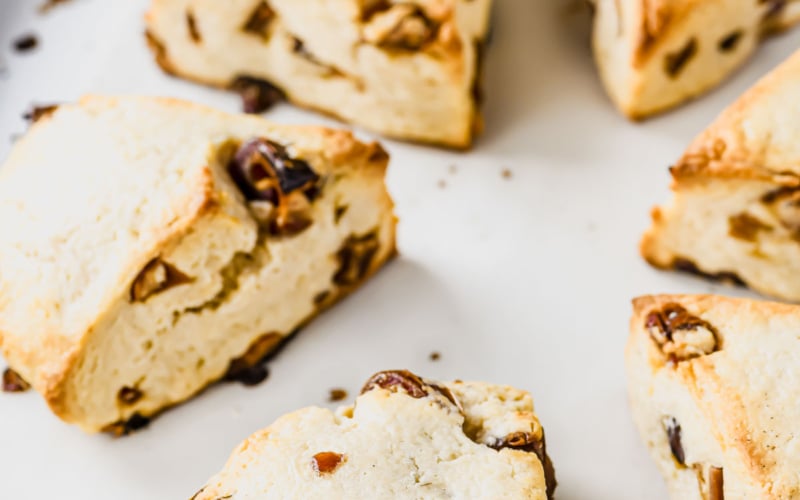 Date scones on a baking sheet.