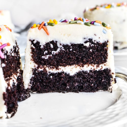 mini chocolate layer cakes frosted and sprinkled.
