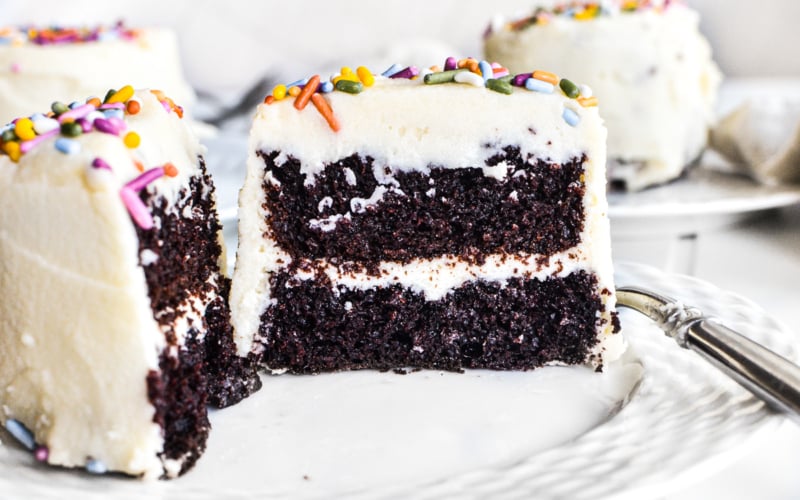 mini chocolate layer cakes frosted and sprinkled.