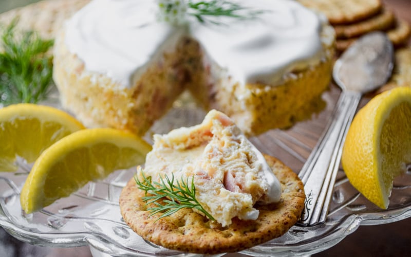 smoked salmon savory cheesecake appetizer, with crackers.