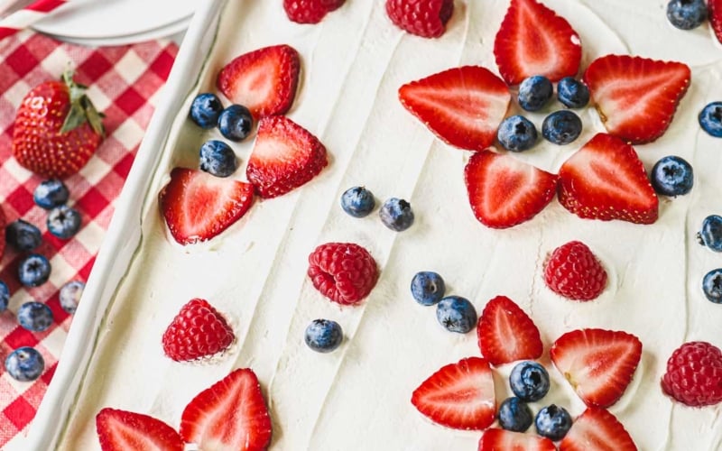 Berry tiramisu in a 9x13 pan, with napkins and paper plates.