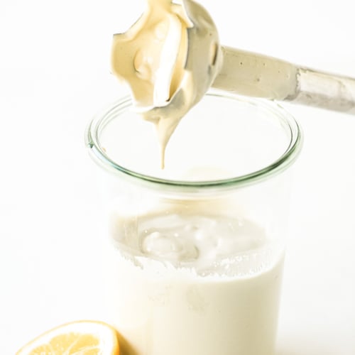 Making whipped tahini sauce with an immersion blender.