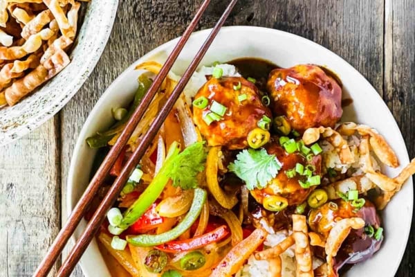 Firecracker chicken meatball bowl with fried wonton strips.