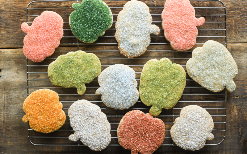 pumpkin sugar cookies on a cooling rack.
