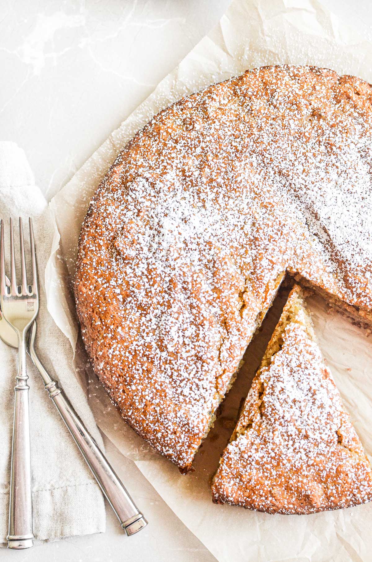 Almond flour banana cake with a slice taken out.
