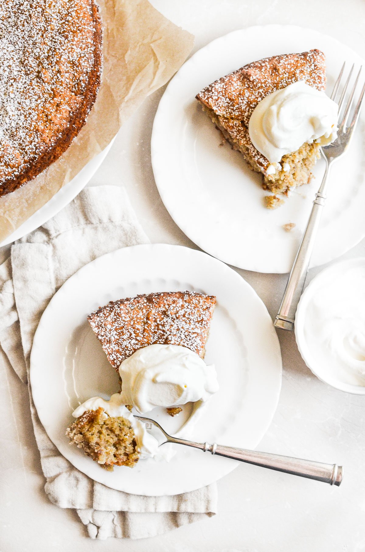 Two servings of almond flour banana cake with whipped cream.