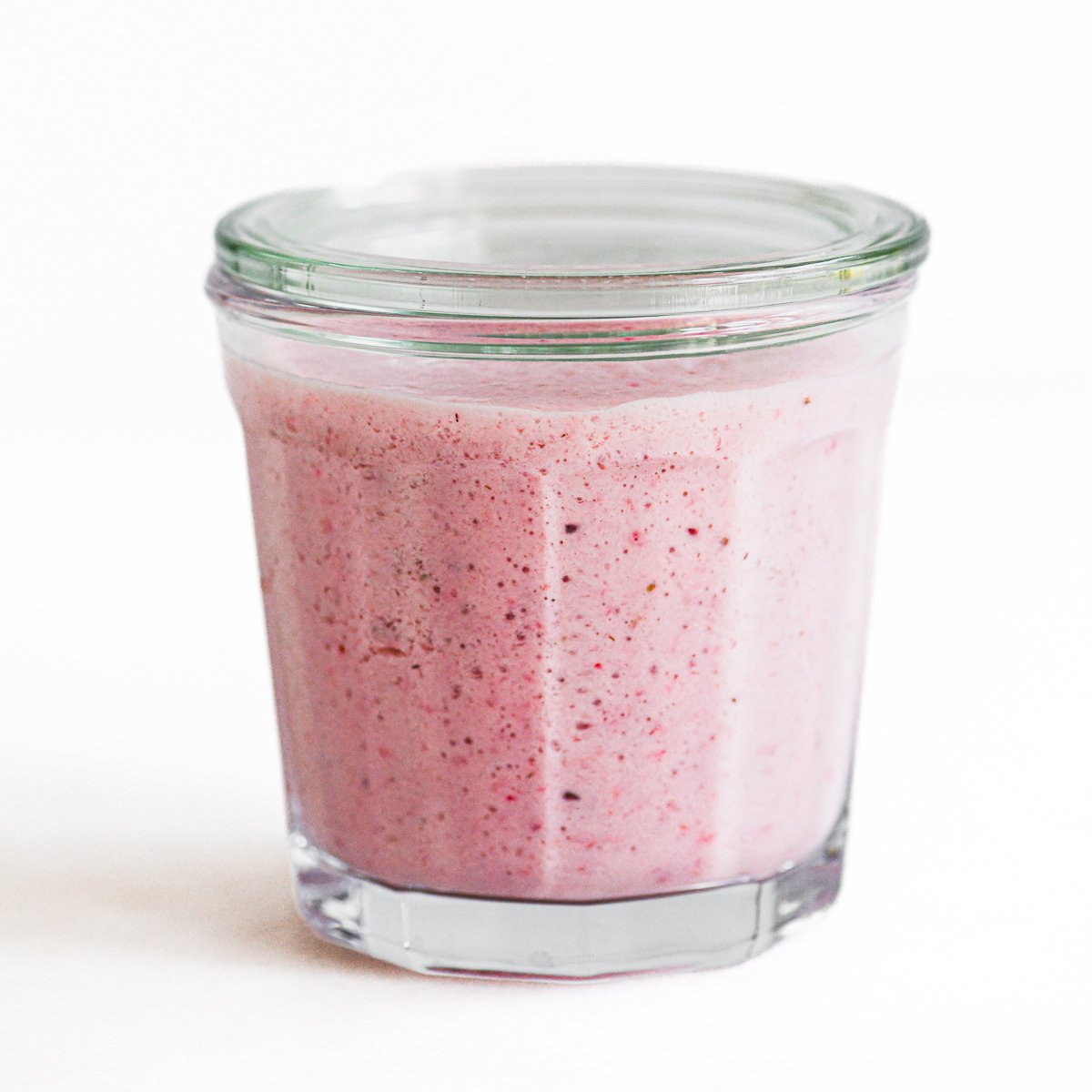 strawberry kefir in a glass with lid.
