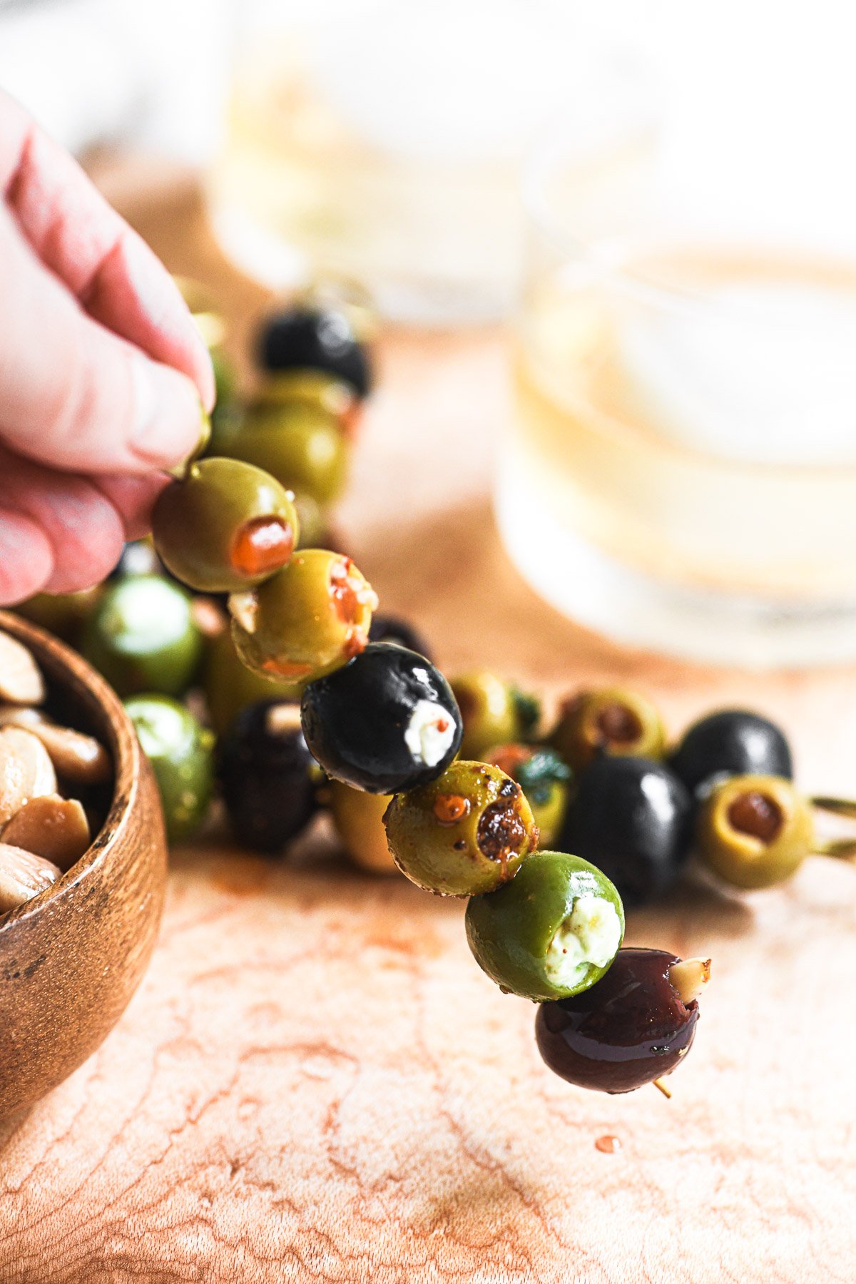 Stuffed olive cocktail picks with multi-colored olives.