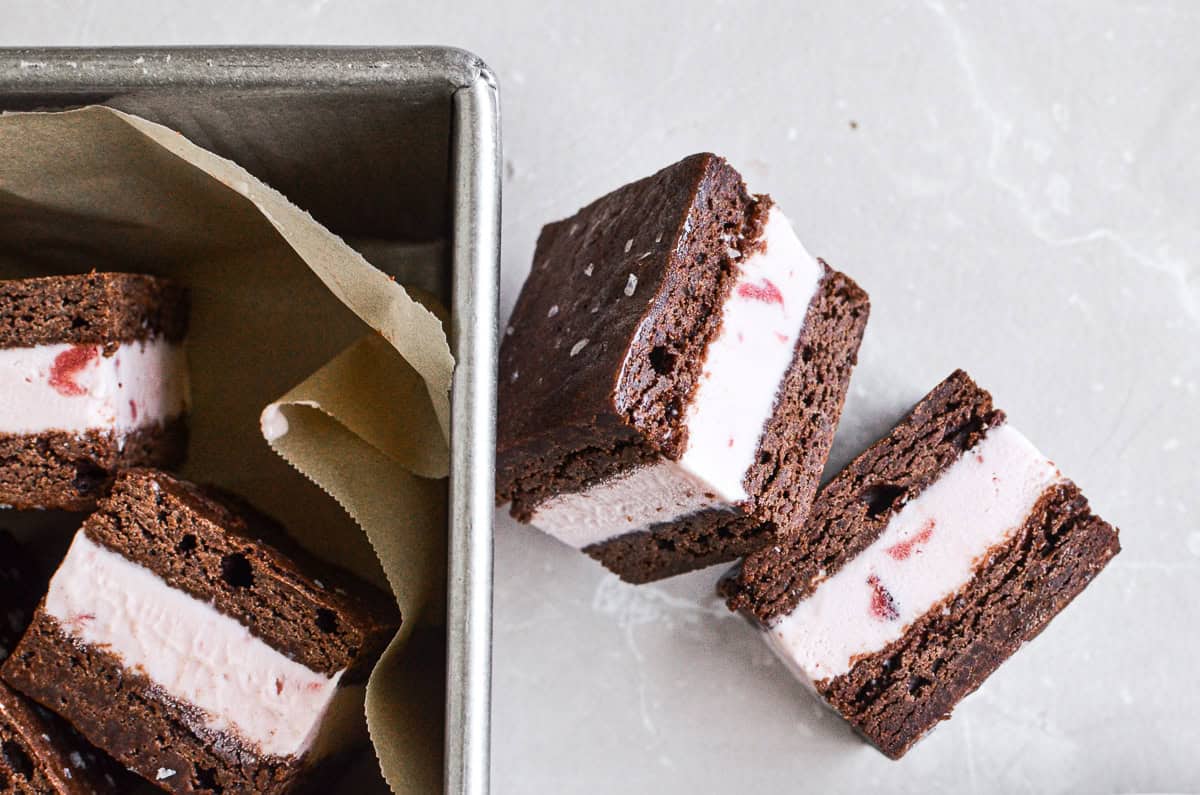 Brownie ice cream sandwiches cut into squares.