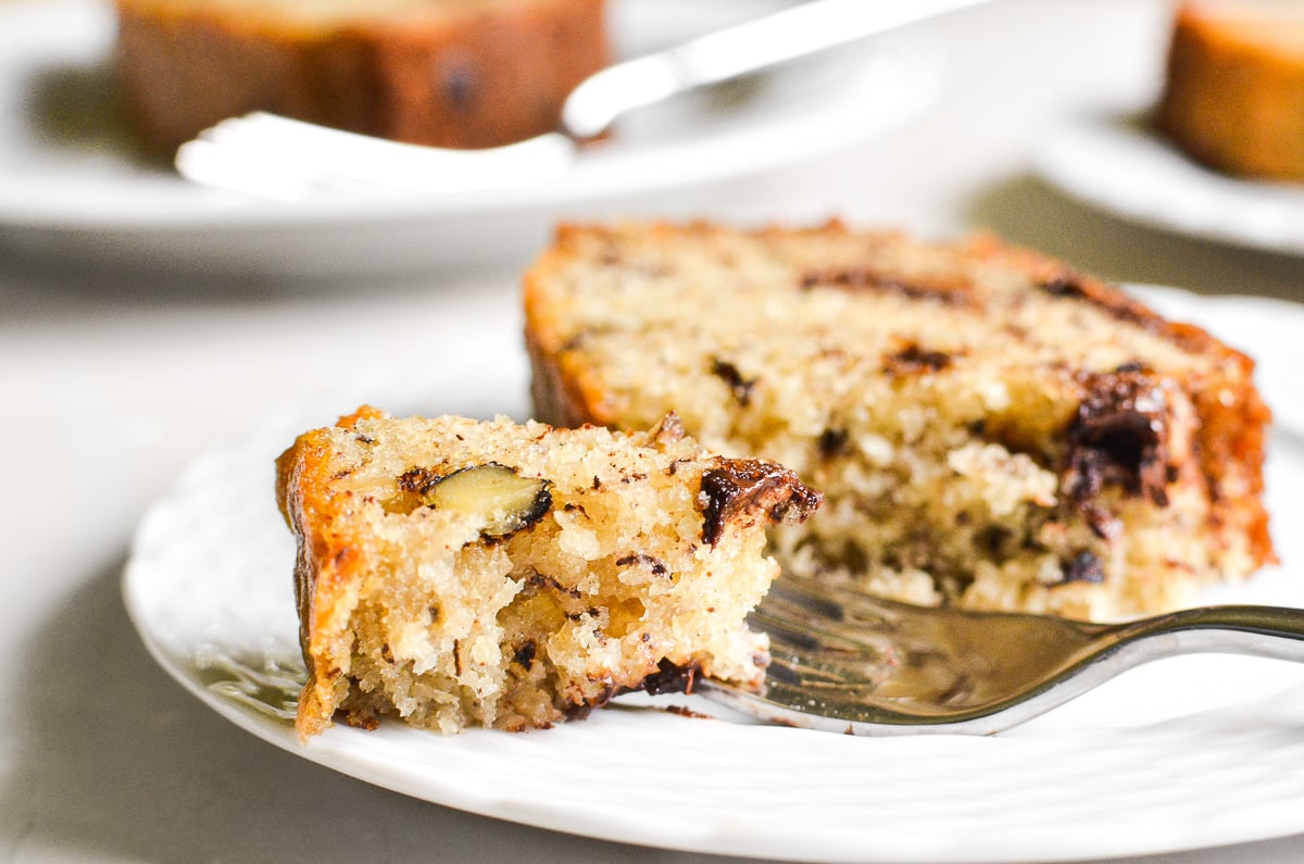 Taking a bite of one banana banana bread.