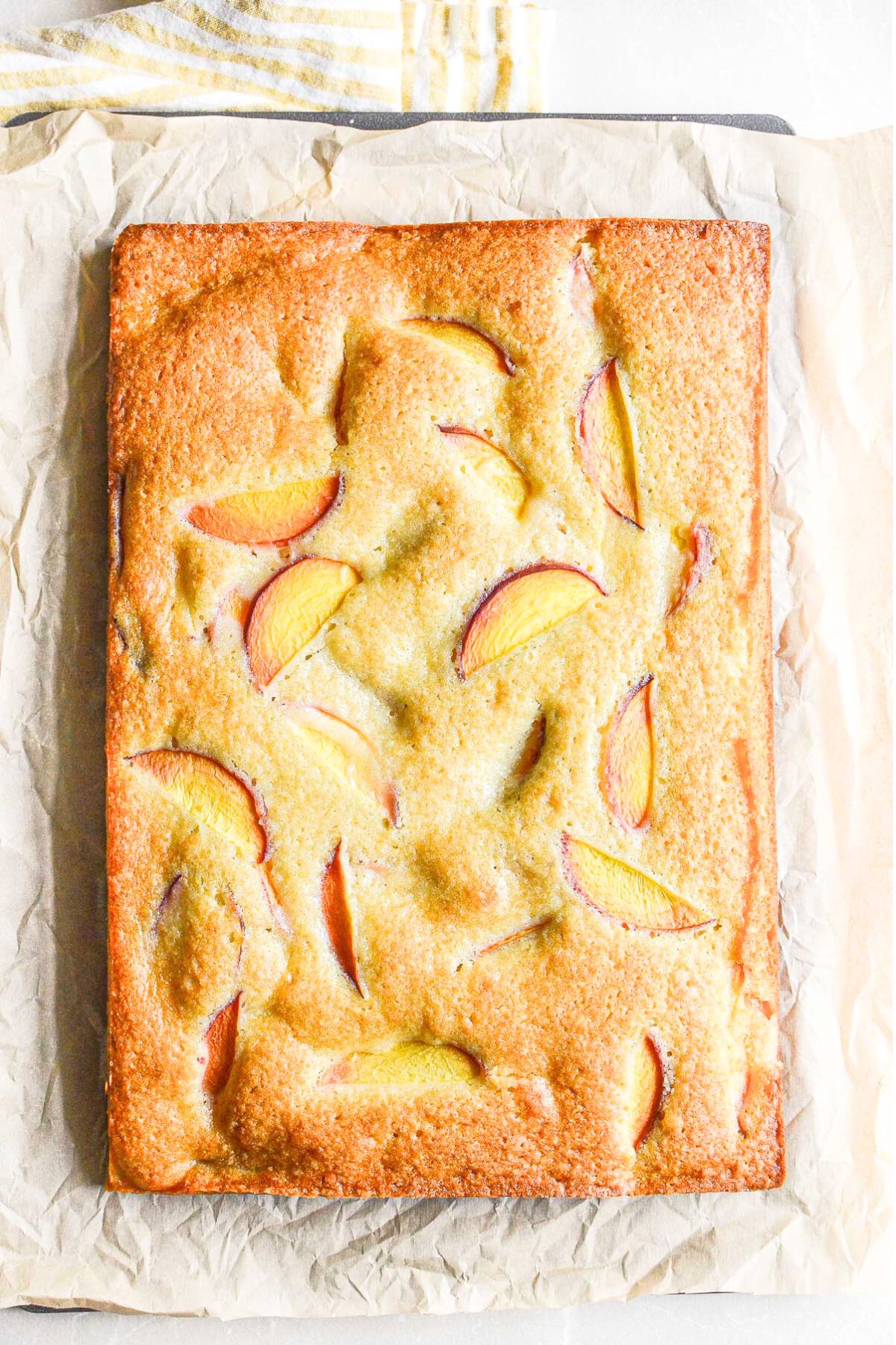 peach almond cake, unsliced.