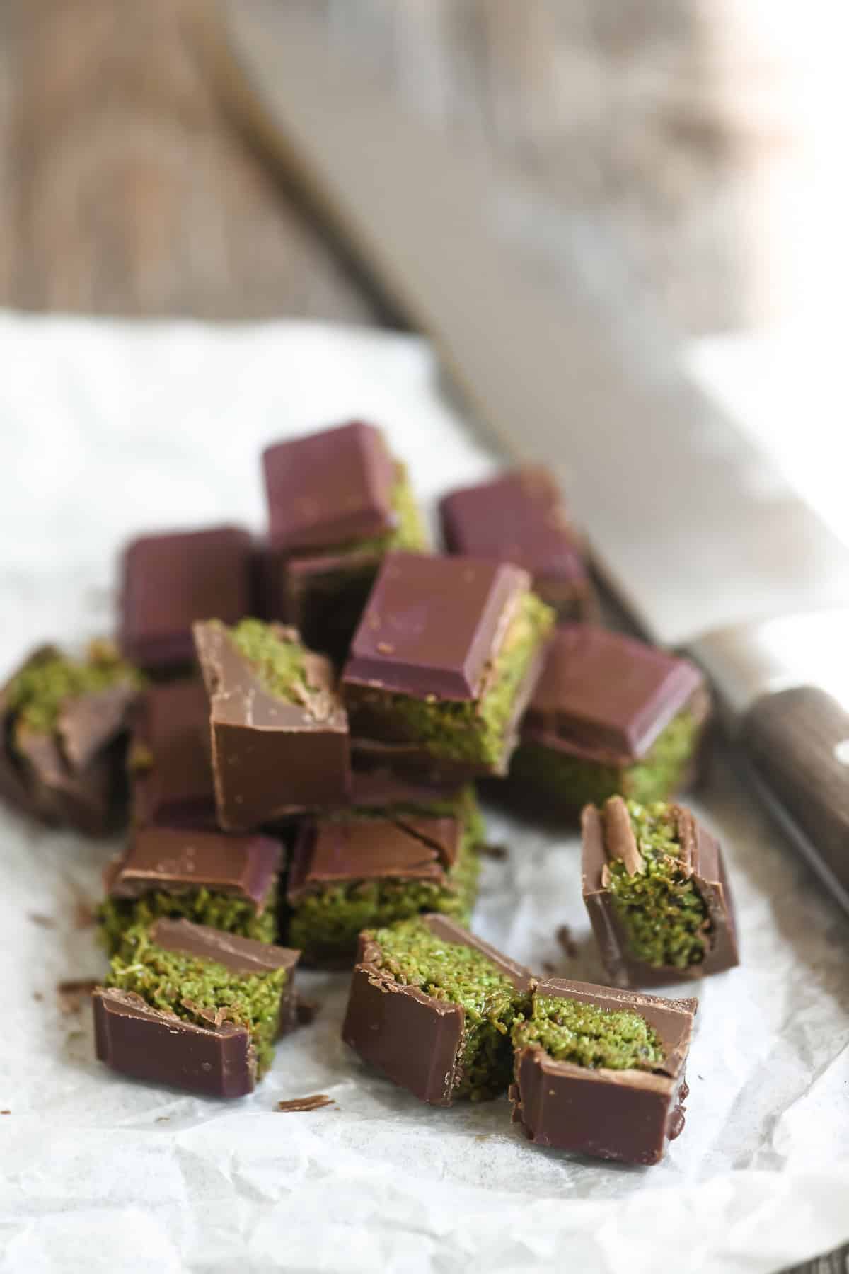 chopping a bar of Dubai chocolate.