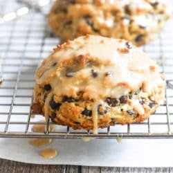 espresso chocolate chip scone dripping with glaze.