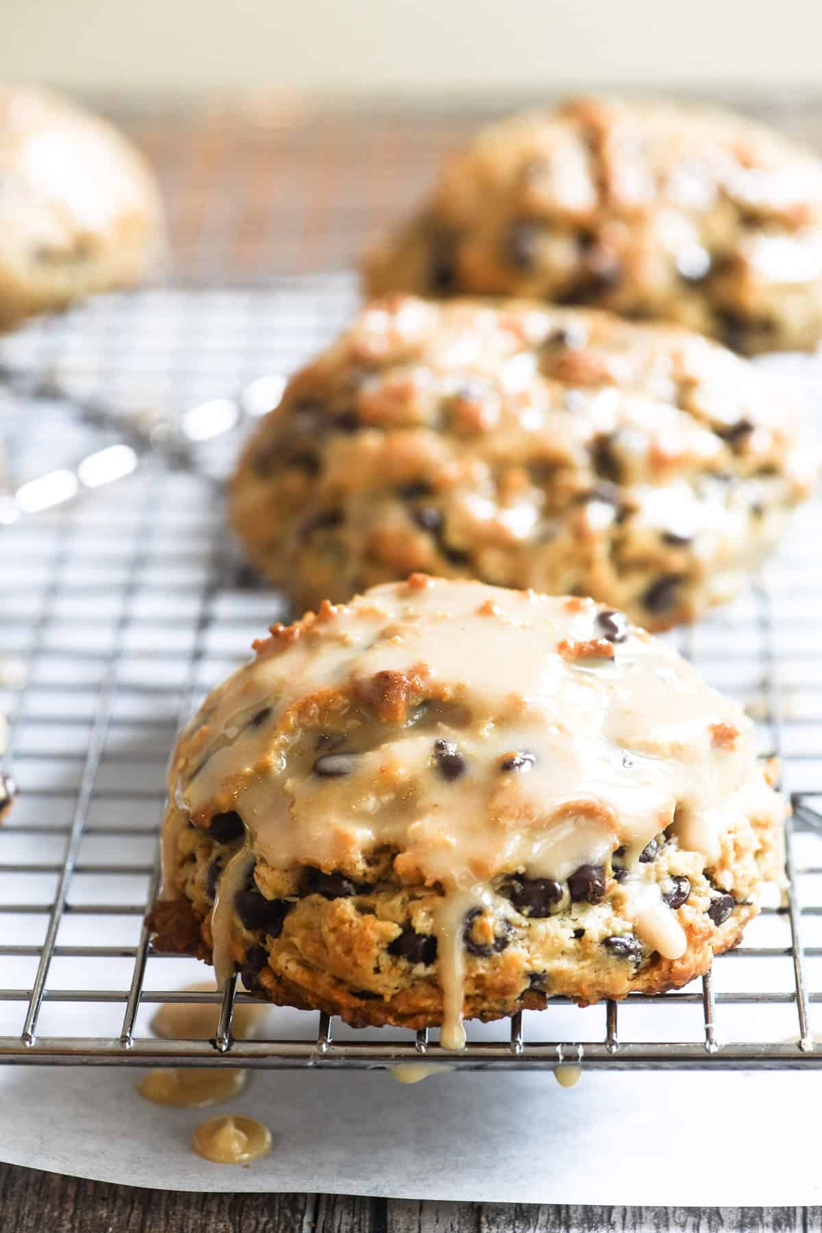 Espresso chocolate chip scones with coffee glaze dripping.