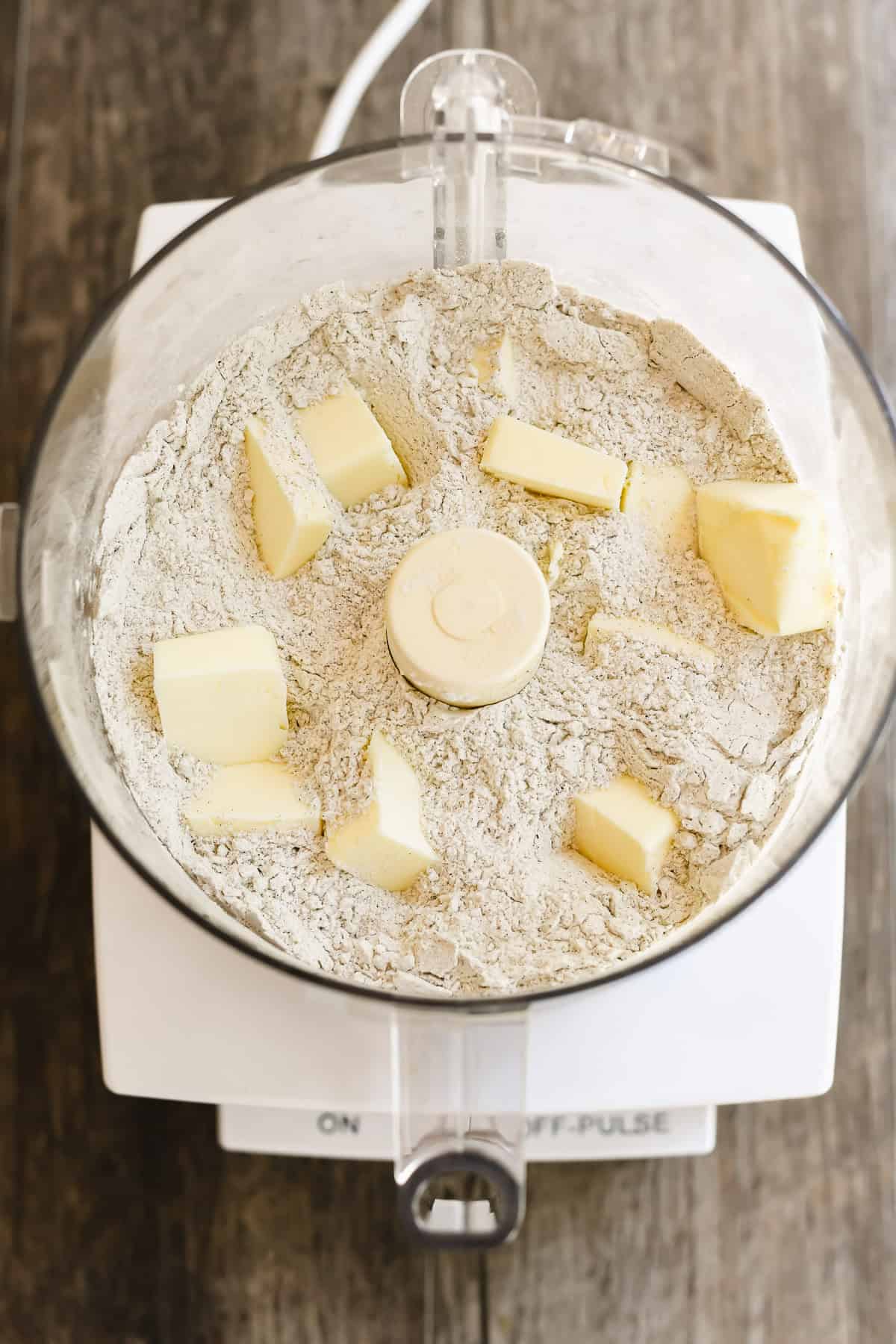 combining dry ingredients in a food processor for buckwheat biscuits.