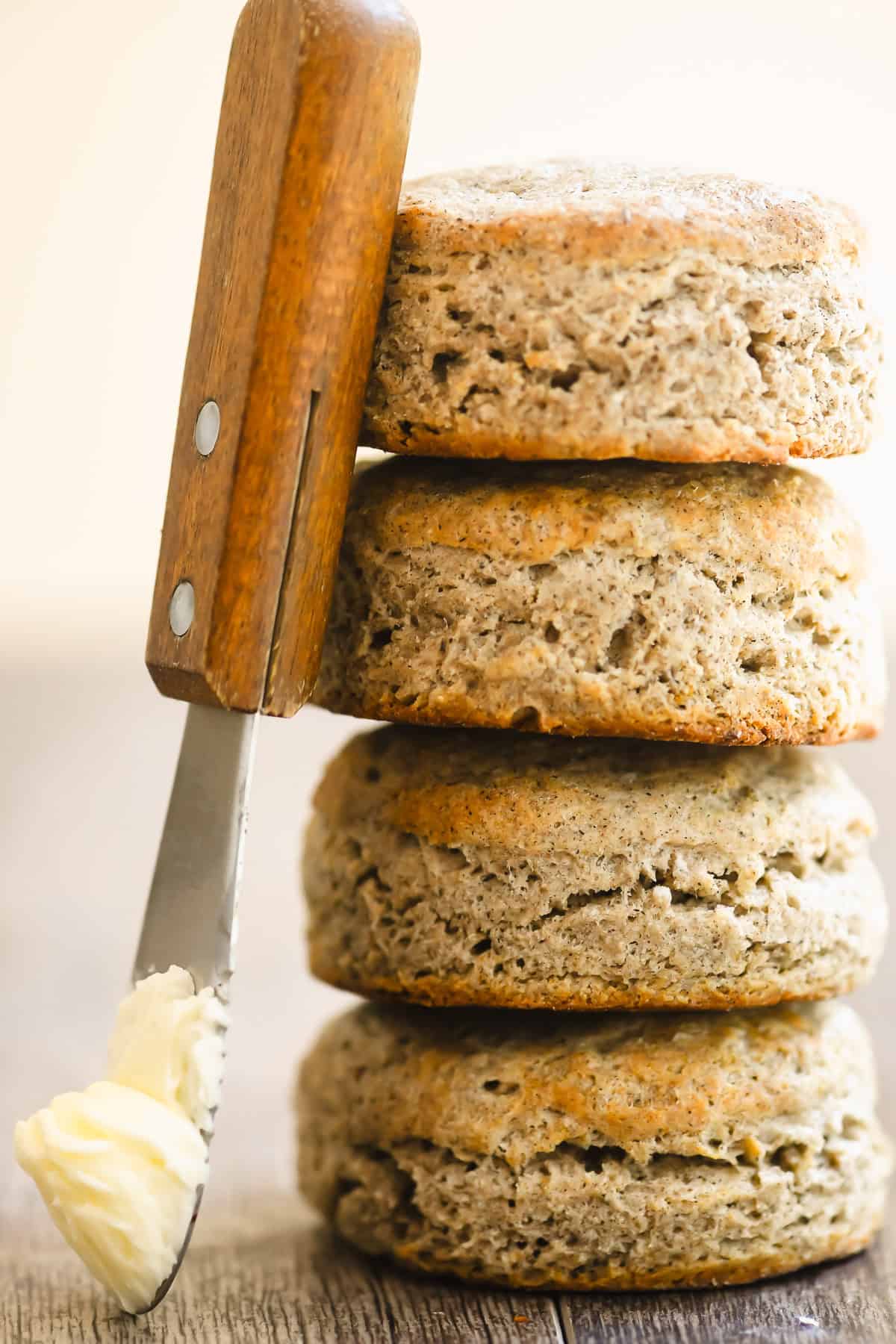 a stack of buckwheat biscuits with butter knife.