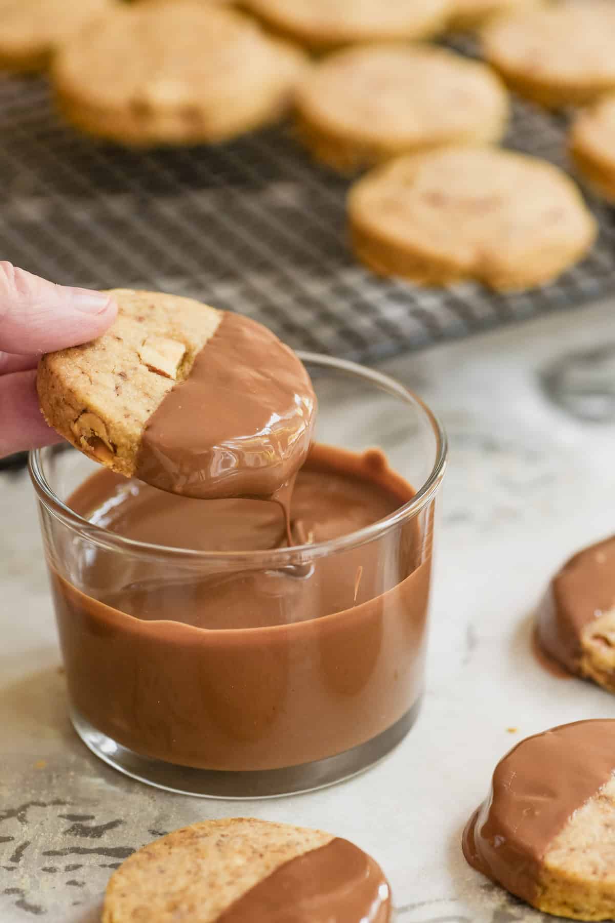 melted chocolate dripping from coffee hazelnut shortbread cookie.