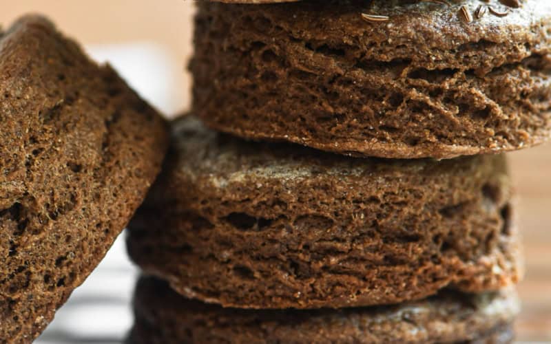 a stack of brown pumpernickel biscuits.