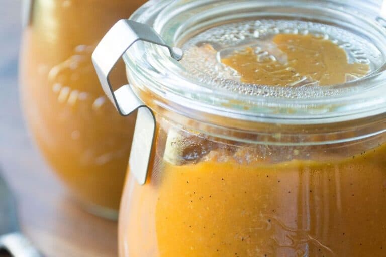 crock pot pumpkin butter in small jars.