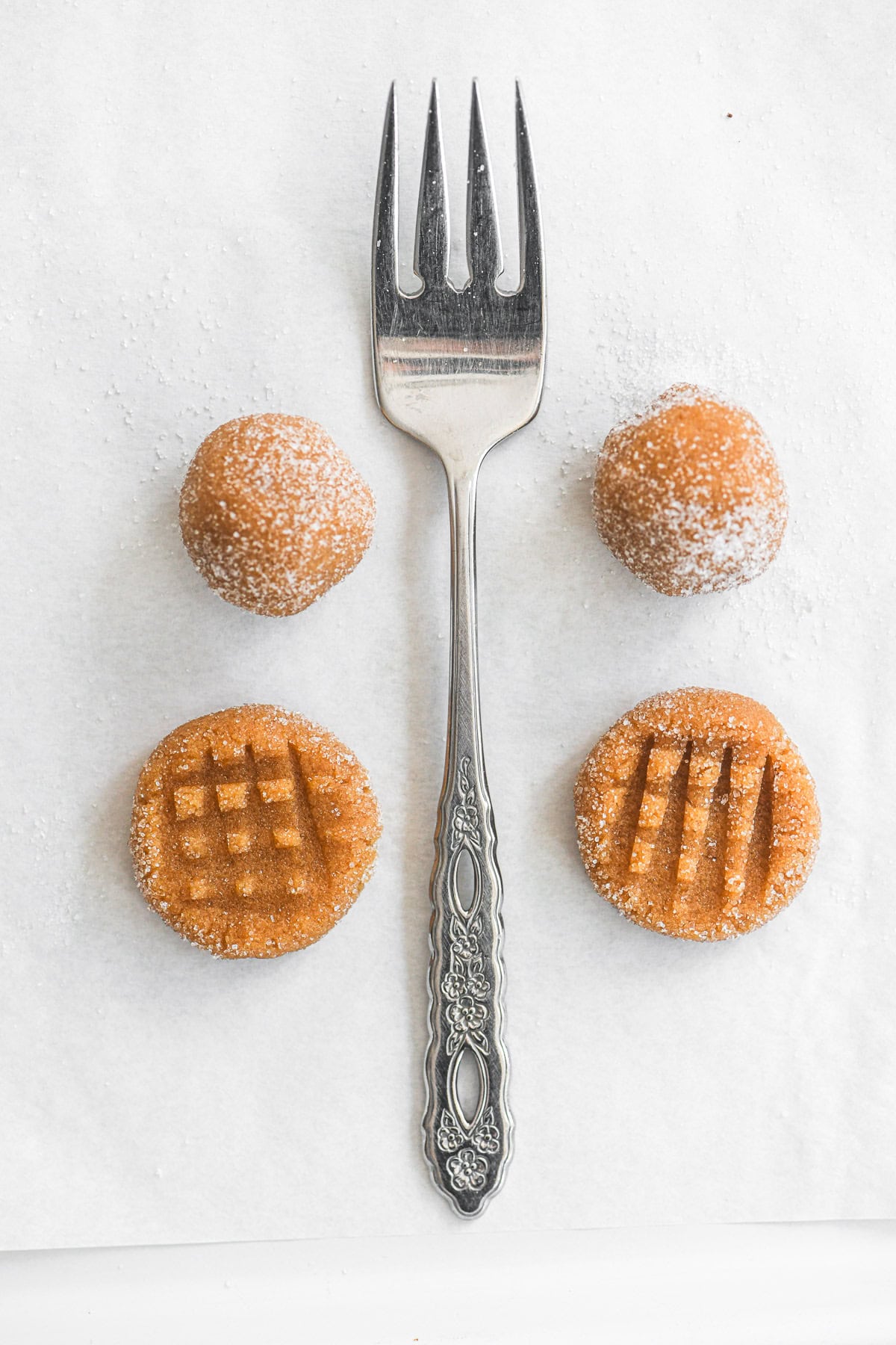 balls of 3 ingredient peanut butter cookies with fork.