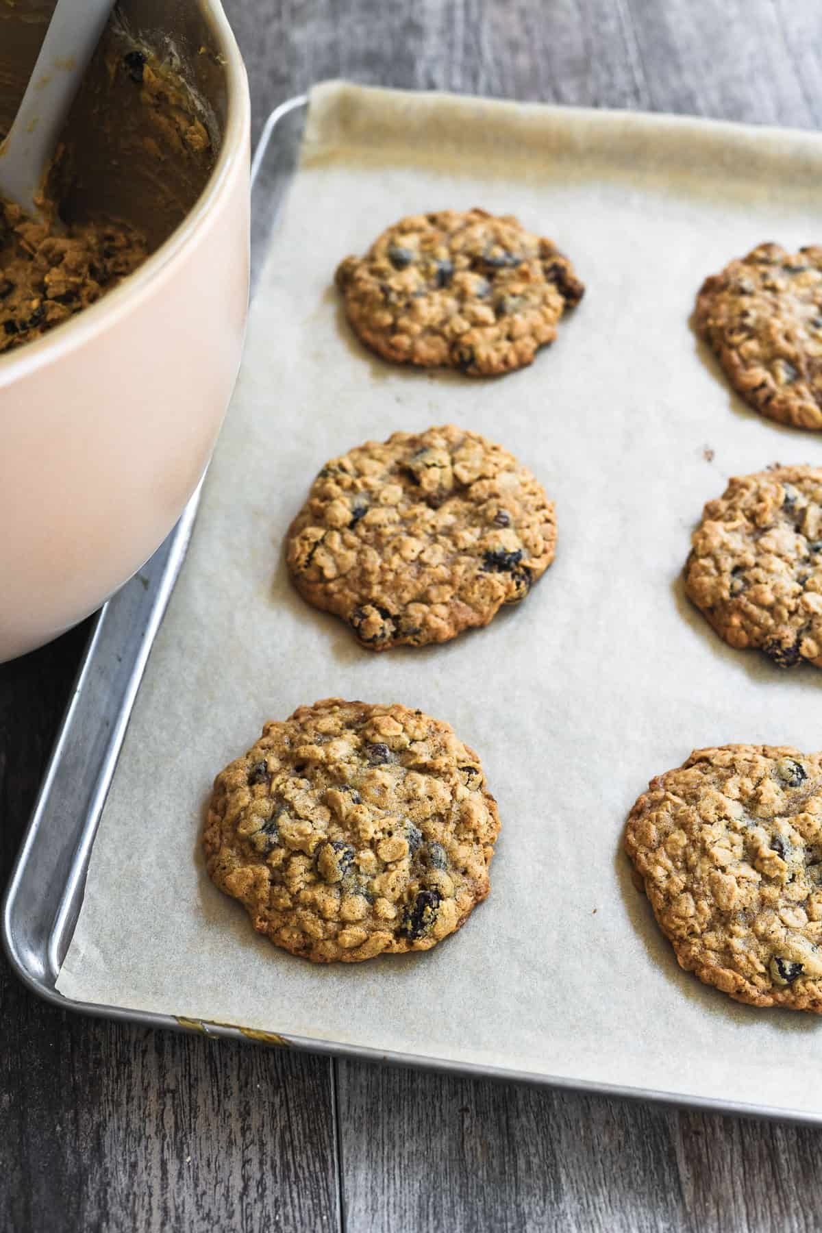 baked oatmeal raisin cookies on a baking sheet