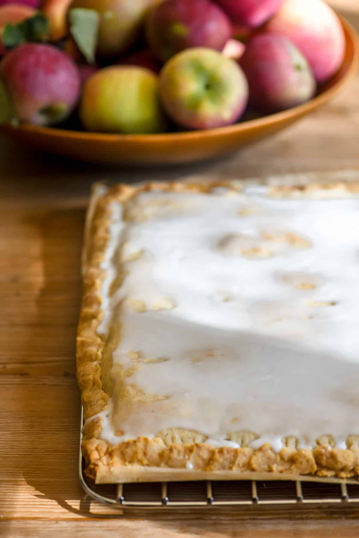 a slab of apple pie bars waiting to be sliced.