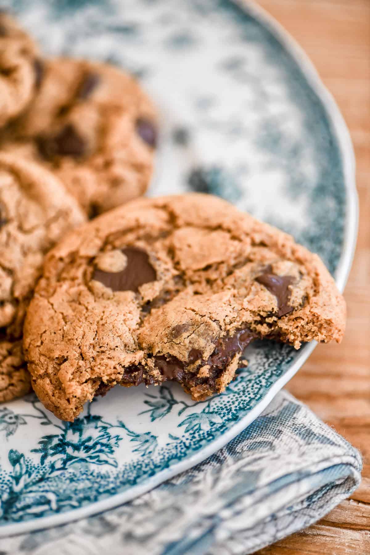 flourless almond butter chocolate chip cookie with bite taken.
