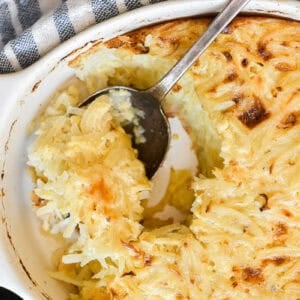 Grated potato casserole with a serving spoon