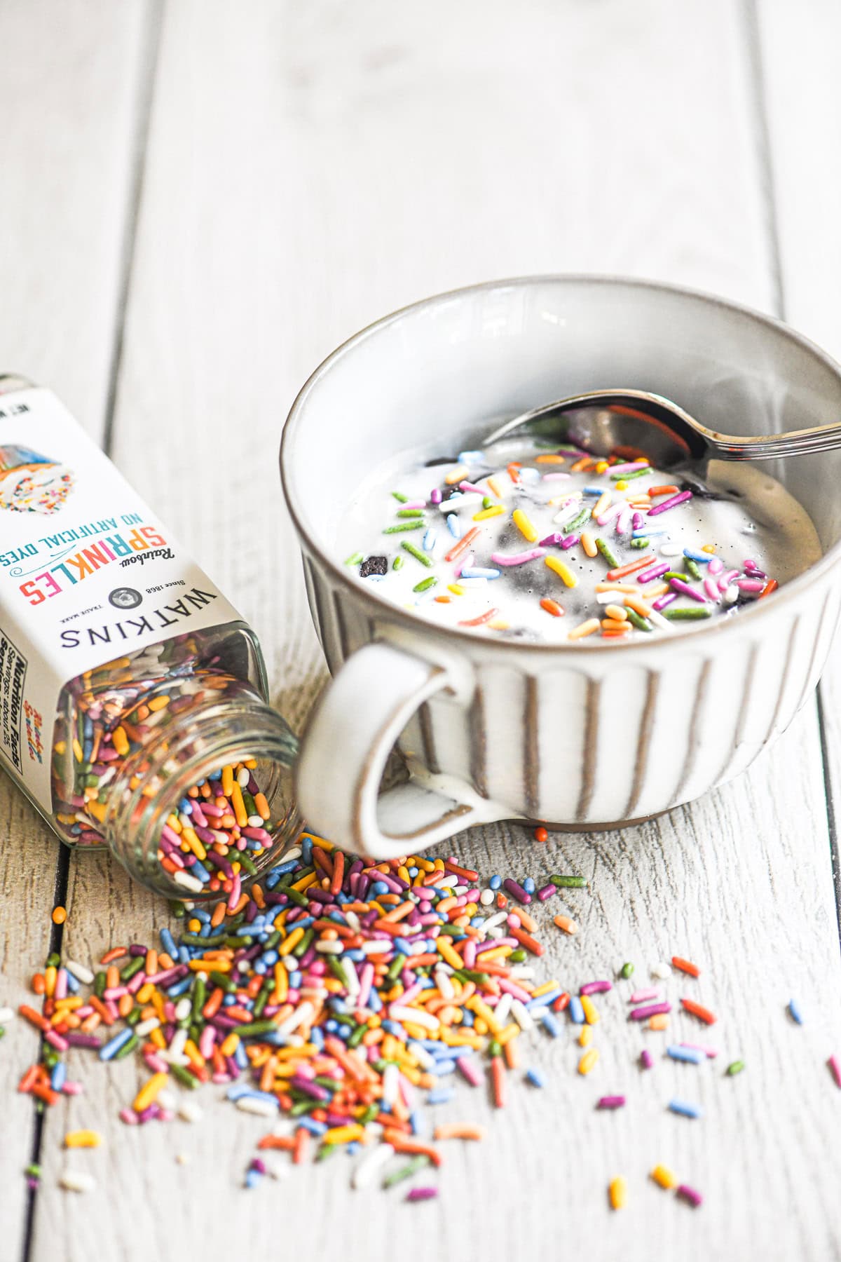 microwave mug cake with spilled sprinkles.