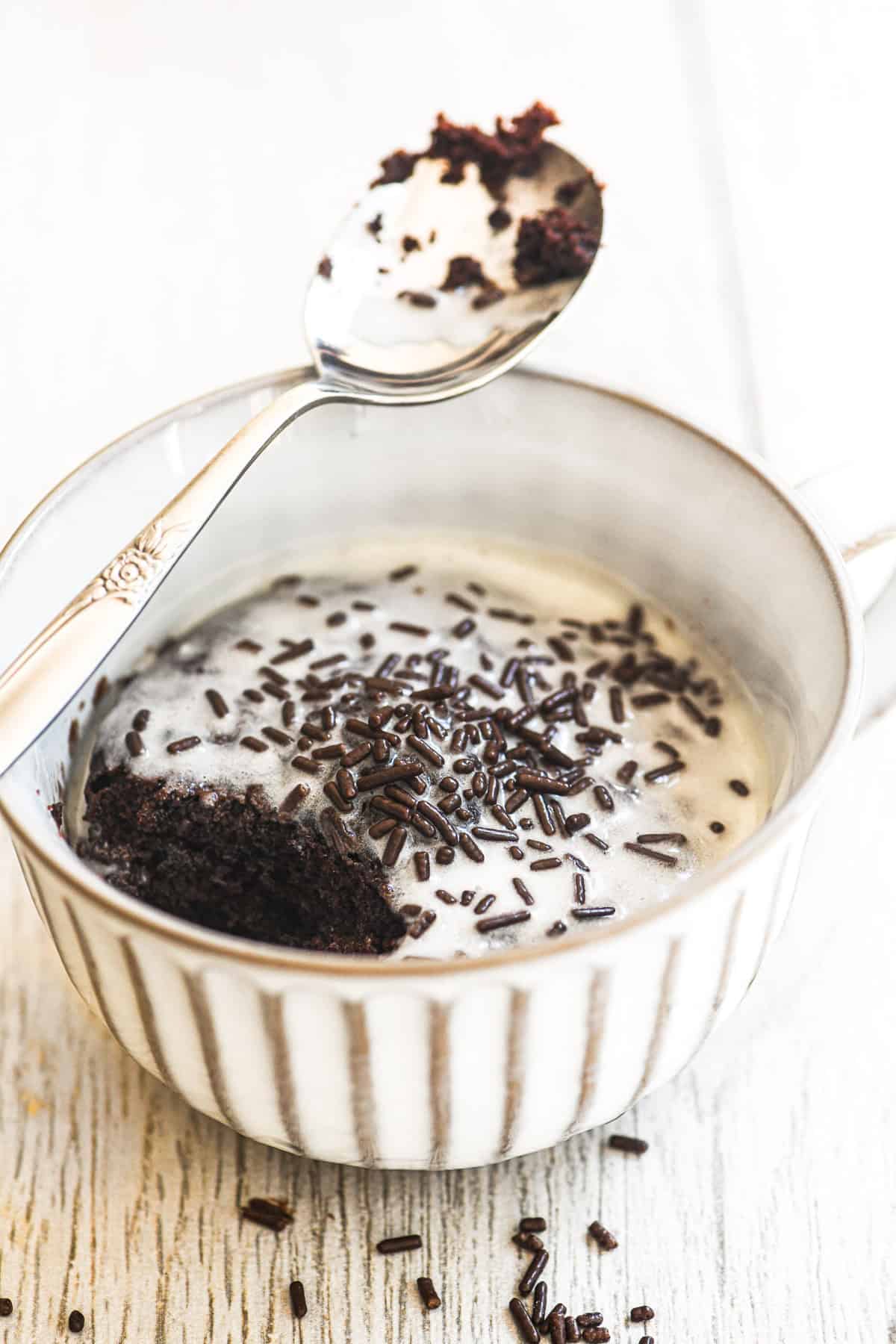 microwave mug cake with bite taken.