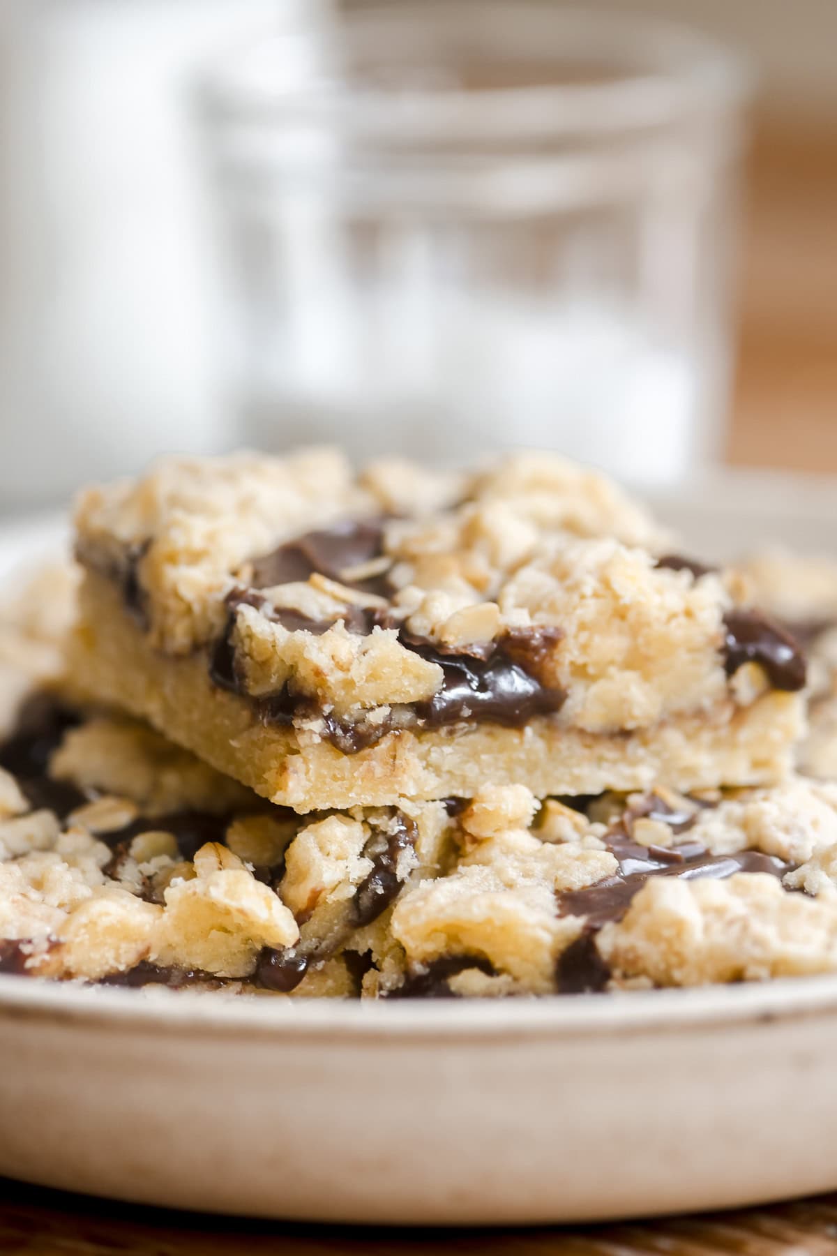 a plate of oatmeal fudge bars with milk bottle.