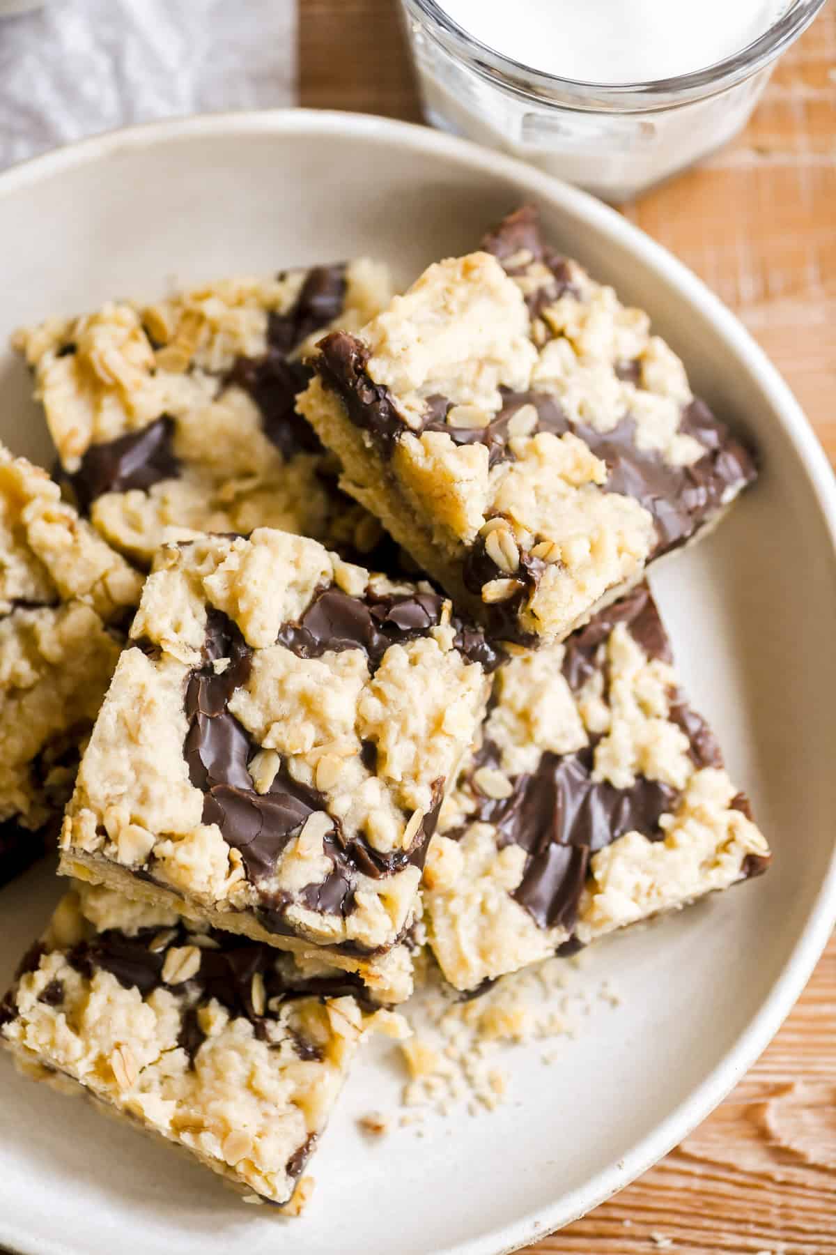 oatmeal fudge bars stacked on a plate.