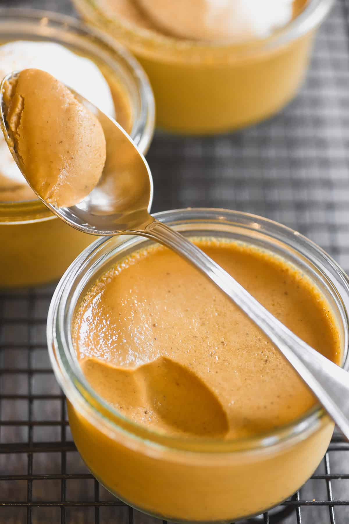 taking a bite of silky creamy pumpkin pot de creme.