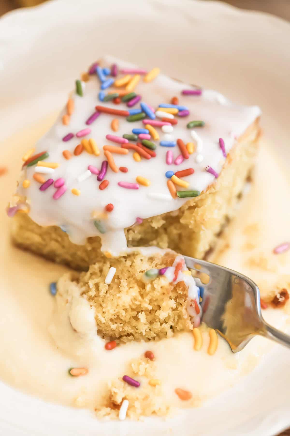 School cake in custard sauce, with fork.