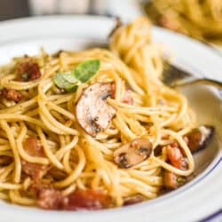 A fast and easy weeknight pasta made with hearty bacon and mushrooms tossed in a warm balsamic vinaigrette!