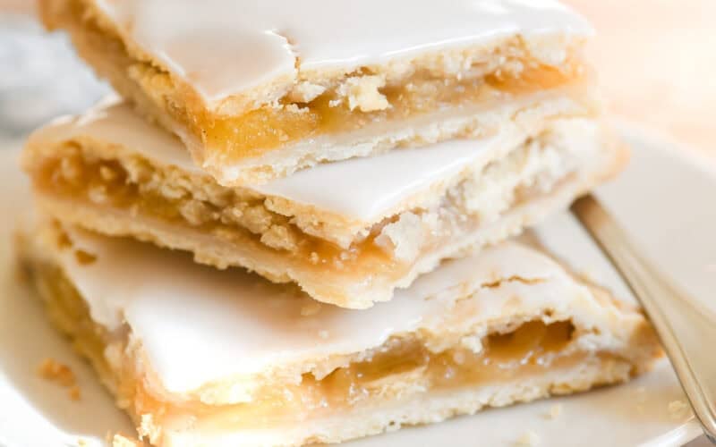 A stack of juicy apple pie bars.