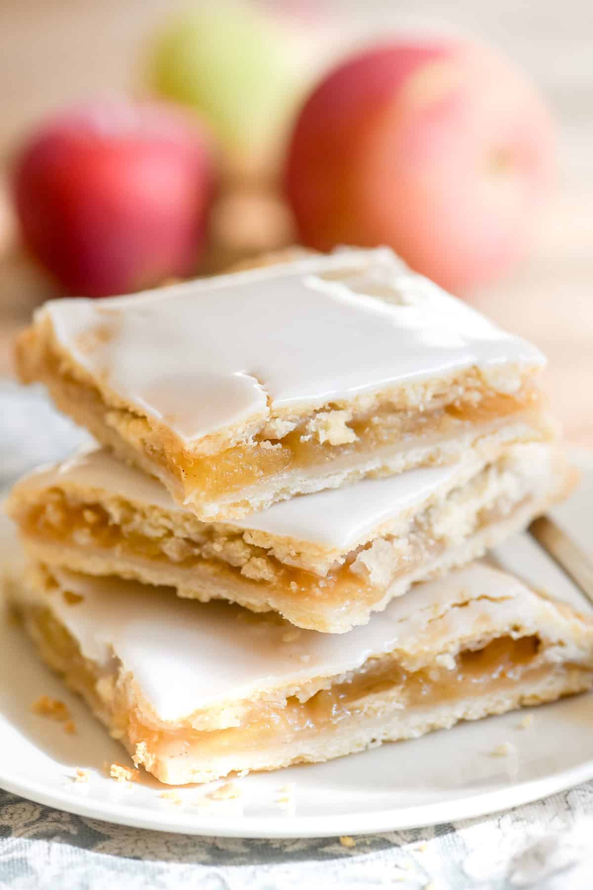 A stack of glazed apple pie bars.