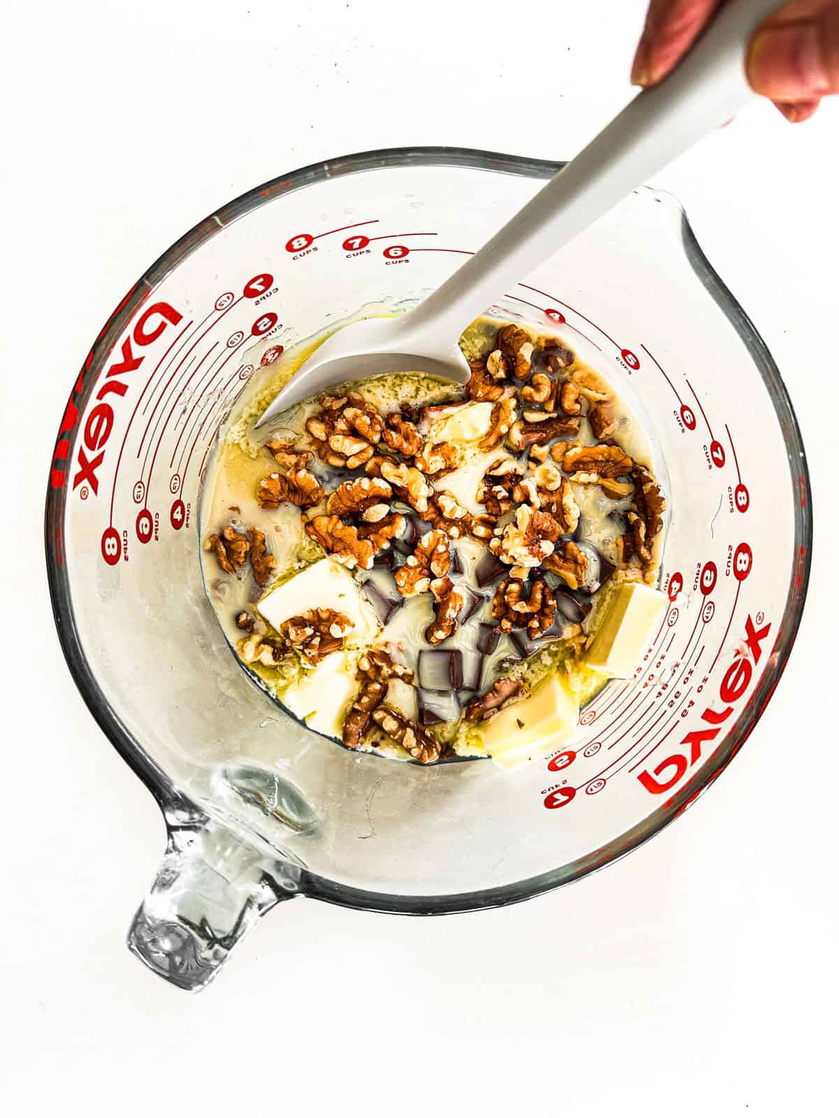 Microwaving fudge ingredients in a pyrex measuring cup.