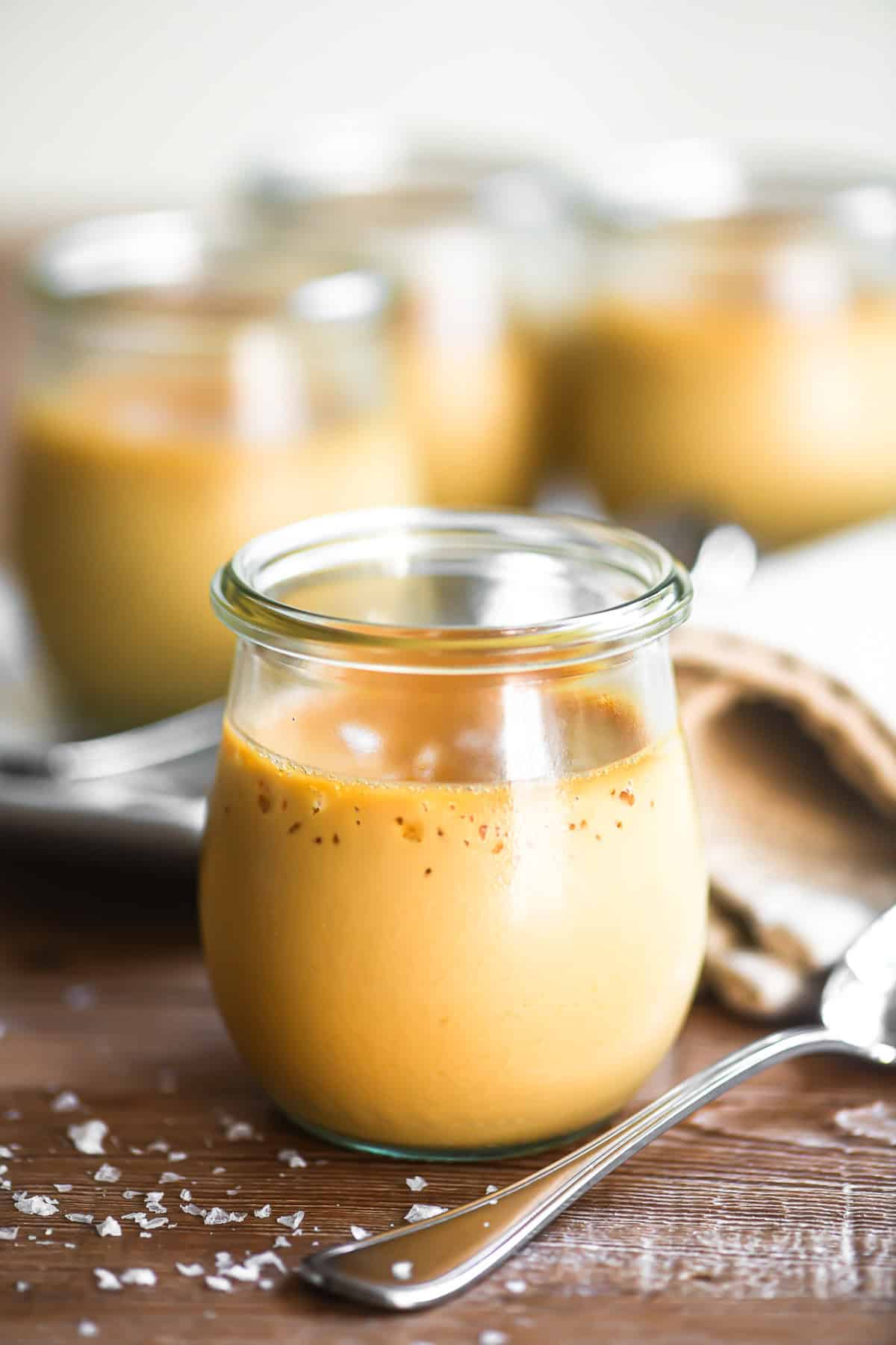 salted caramel pot de creme in small Weck tulip jars.