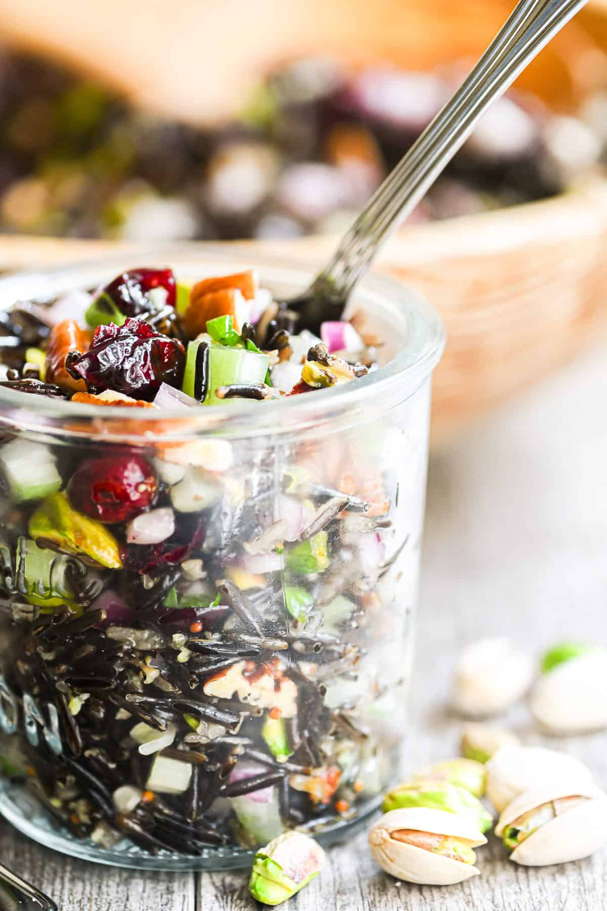 jar of wild rice salad with cranberries and nuts.