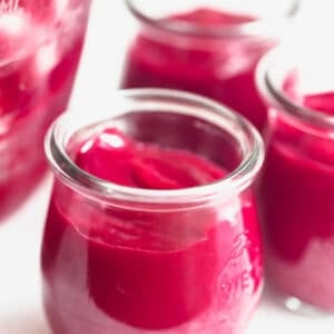 Freshly made cranberry orange curd in Weck jars.
