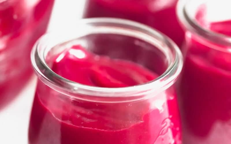 Freshly made cranberry orange curd in Weck jars.